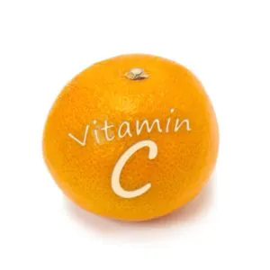 An orange fruit with the text 'Vitamin C' creatively displayed on its surface.